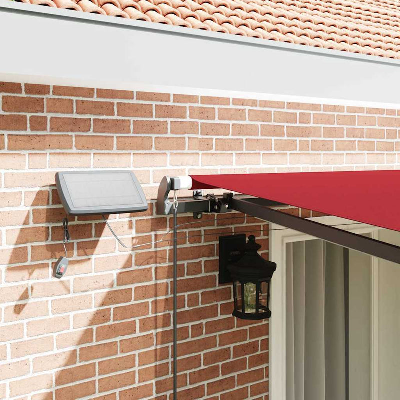vidaXL Behúzható napellenző LED -es lámpákkal Piros 400 ×350 cm szövet