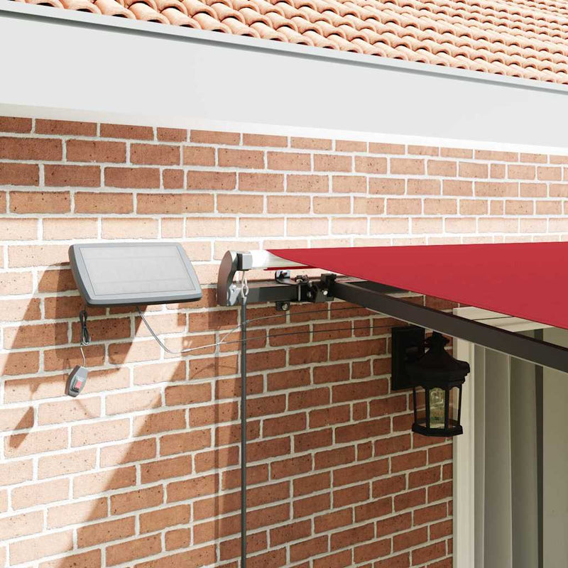 vidaXL Behúzható napellenző LED -es lámpákkal Piros 450 ×300 cm szövet