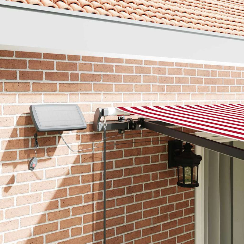 vidaXL Behúzható napellenző Piros és fehér 450 ×350 cm szövet
